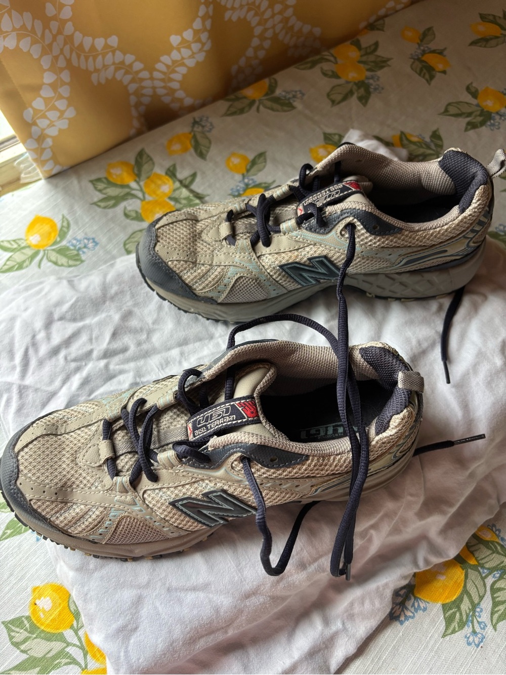 New Balance women’s size 8B women’s
Beige and Black Athletic Sneakers all terrai
